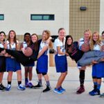 girls-basketball-team-holding-coaches-2-509x509